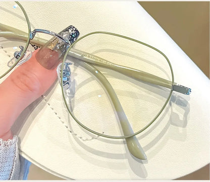 Clear Glasses for Women: Polygonal Metal Frame Eyeglasses with Flat Mirror Lenses, Designed for Girls, Featuring Anti-Blue Light Technology and Fashionable Eyewear Aesthetics.