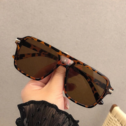 Introducing our latest collection of stylish rectangular eyewear, designed for both men and women. These glasses offer a blend of retro charm and contemporary trends, perfect for any occasion.