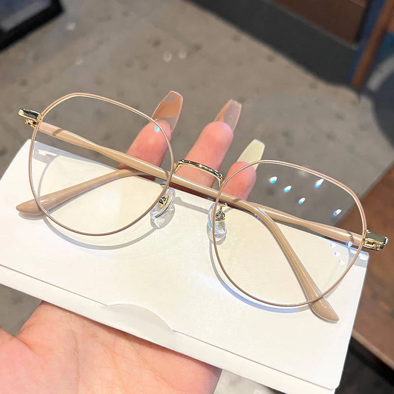 Clear Glasses for Women: Polygonal Metal Frame Eyeglasses with Flat Mirror Lenses, Designed for Girls, Featuring Anti-Blue Light Technology and Fashionable Eyewear Aesthetics.