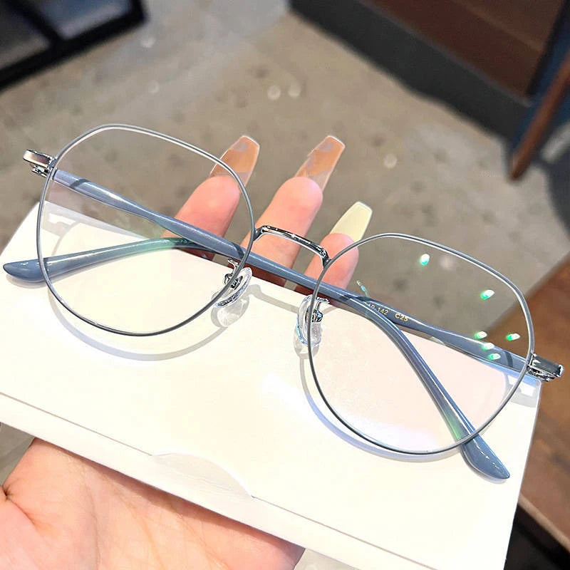 Clear Glasses for Women: Polygonal Metal Frame Eyeglasses with Flat Mirror Lenses, Designed for Girls, Featuring Anti-Blue Light Technology and Fashionable Eyewear Aesthetics.