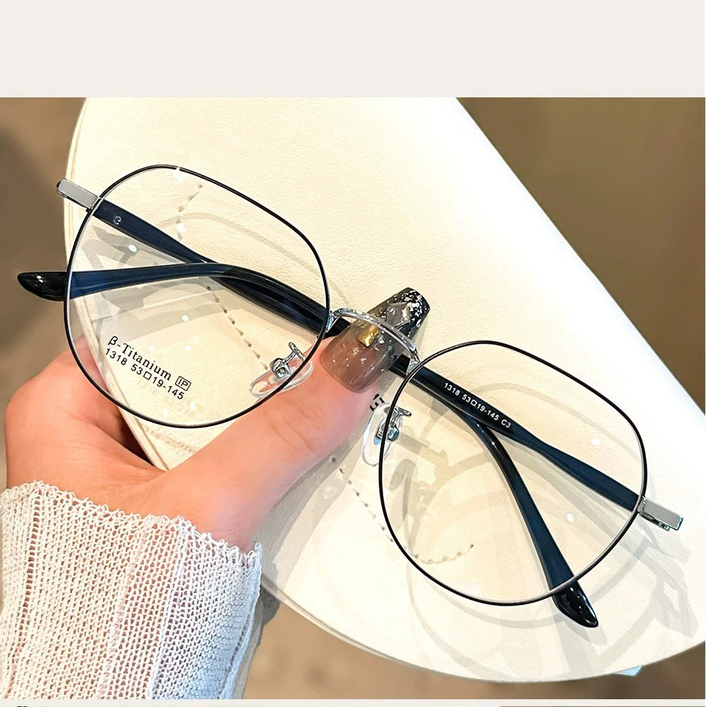 Clear Glasses for Women: Polygonal Metal Frame Eyeglasses with Flat Mirror Lenses, Designed for Girls, Featuring Anti-Blue Light Technology and Fashionable Eyewear Aesthetics.